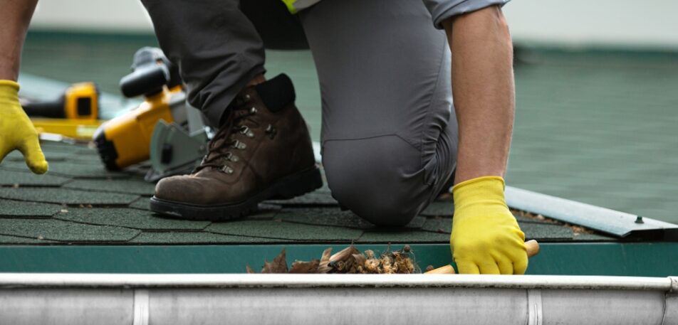 Gutter cleaning service performed by AJM Soft Wash Plus technician